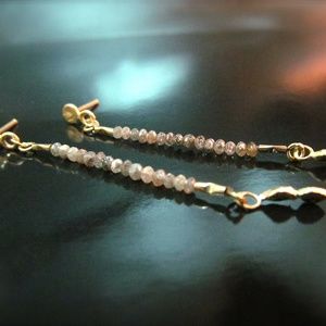 14k yellow gold earrings with rough Diamonds.